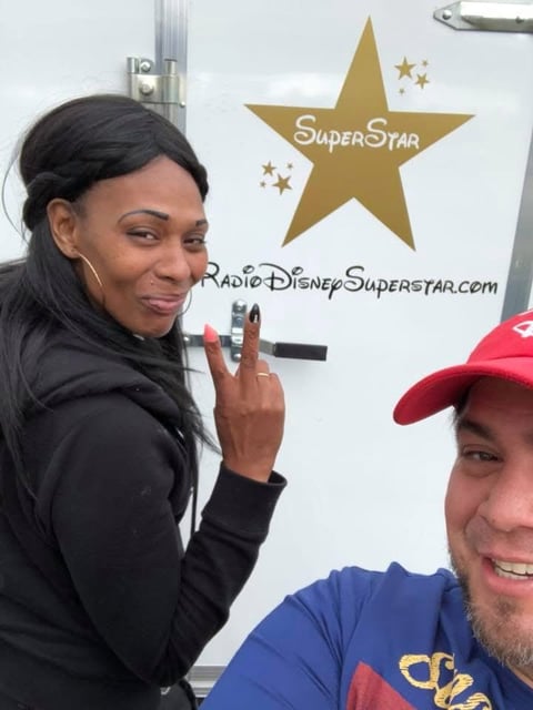 Two people posing at Radio Disney event