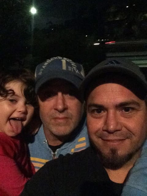 Three men nighttime selfie