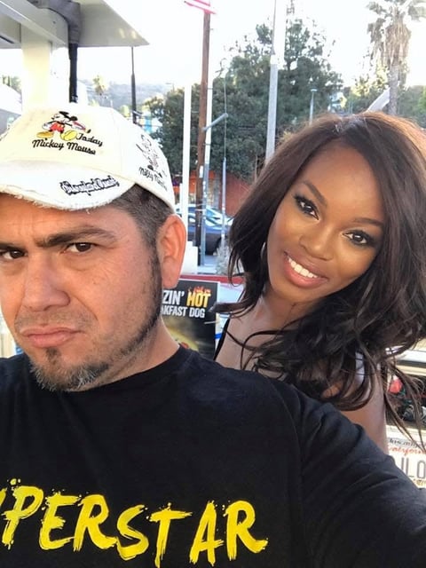 Two people posing for a selfie outdoors