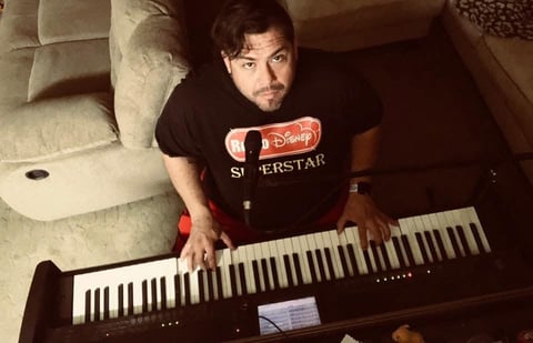 Man playing electronic keyboard